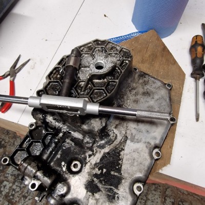 Repairing stripped threads in a sump drain, cutting the counterbore.